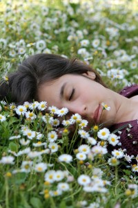 woman sleeping in meadow